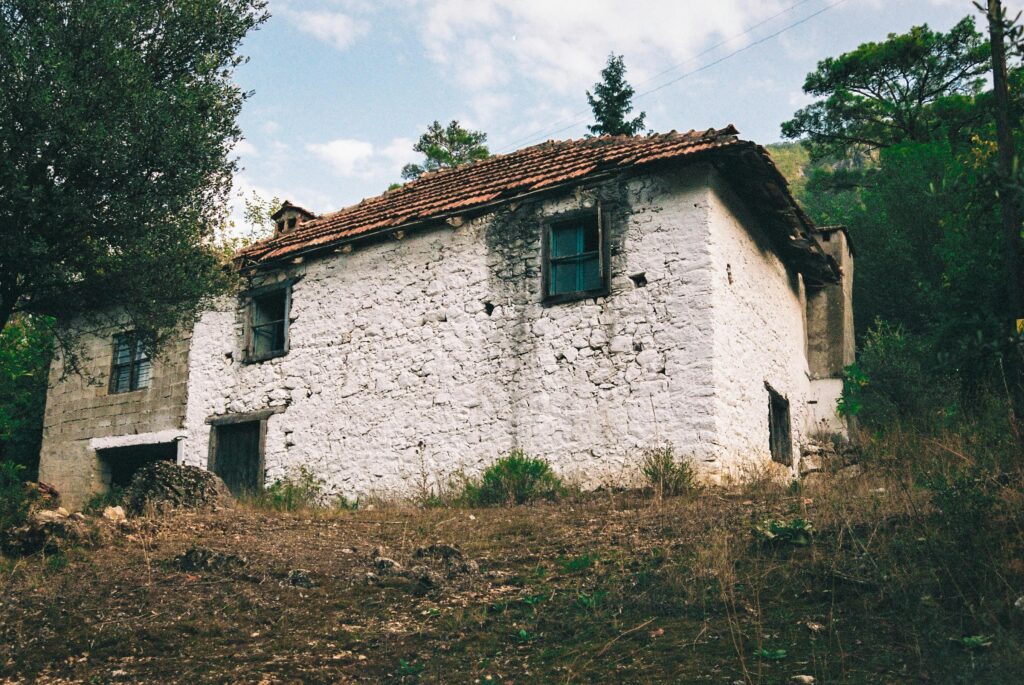 pexels-photo-14604557-14604557 An aged, rustic stone house abandoned in the quiet countryside.